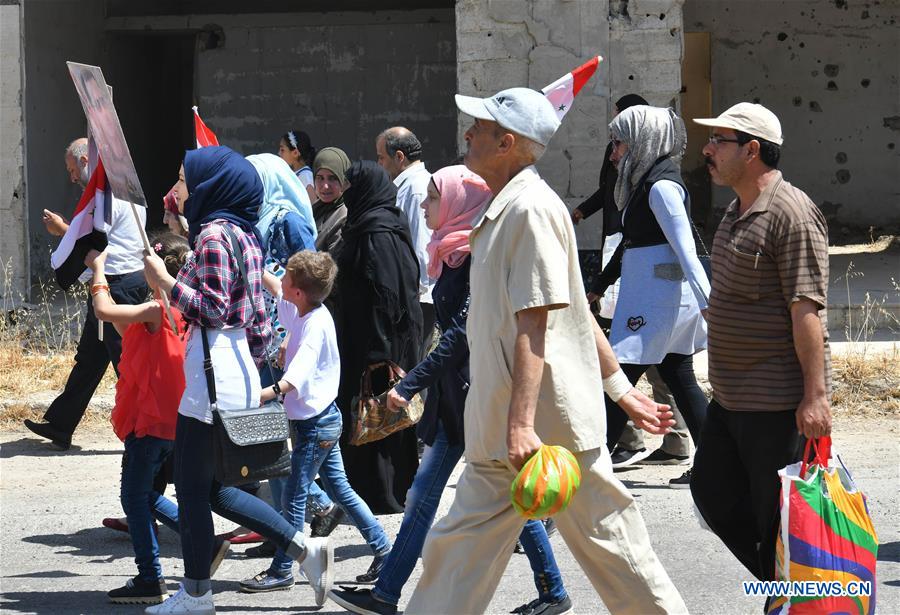 SYRIA-HOMS-CIVILIANS-RETURNING HOME