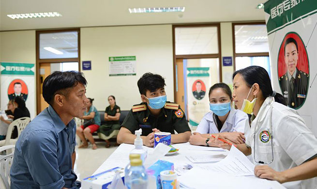 China's PLA Peace Train medical team provides treatment services in Laos