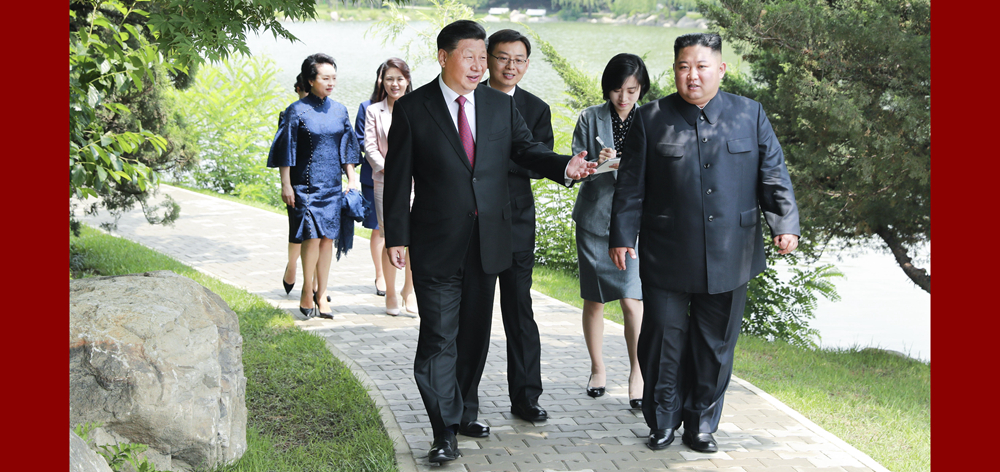 习近平会见朝鲜劳动党委员长、国务委员会委员长金正恩